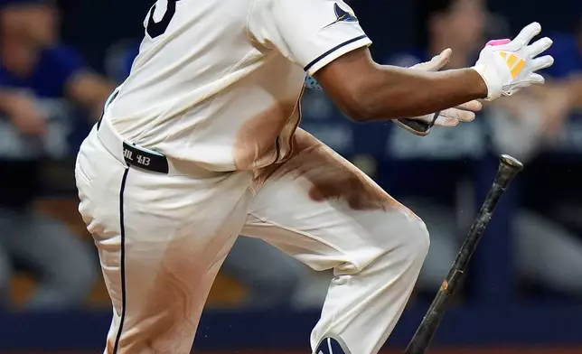 Tampa Bay Rays' Junior Caminero watches his RBI triple off Texas Rangers pitcher Peyton Gray during the sixth inning of a baseball game Tuesday, July 28, 2026, in St. Petersburg, Fla. (AP Photo/Chris O'Meara)