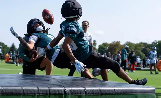 Philadelphia Eagles wide receiver Makai Lemon (9) runs a drill with wide receiver Samori Toure (46) during practice at the team's NFL football training camp in Philadelphia, Wednesday, July 29, 2026. (AP Photo/Chris Szagola)