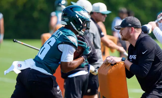Philadelphia Eagles running back Saquon Barkley (26) runs a drill during practice at the team's NFL football training camp in Philadelphia, Wednesday, July 29, 2026. (AP Photo/Chris Szagola)