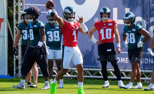Philadelphia Eagles quarterback Jalen Hurts (1) runs a drill during practice at the team's NFL football training camp in Philadelphia, Wednesday, July 29, 2026. (AP Photo/Chris Szagola)