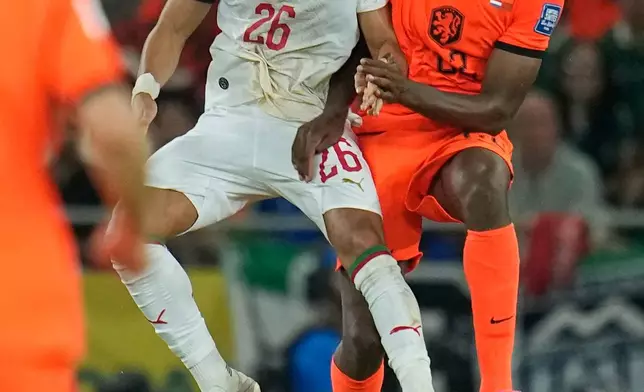 Morocco's Anass Salah Eddine (26) and Netherlands' Denzel Dumfries (22) compete fr the ball during the World Cup round of 32 soccer match between the Netherlands and Morocco in Guadalupe, near Monterrey, Mexico, Monday, June 29, 2026. (AP Photo/Ricardo Mazalan)