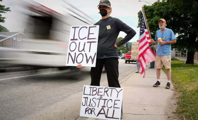 Members of the Capitol Area Indivisible group protest against U.S. Immigration and Customs Enforcement outside the Edmund Muskie Federal Building, Thursday, July 16, 2026, in Augusta, Maine. (AP Photo/Robert F. Bukaty)