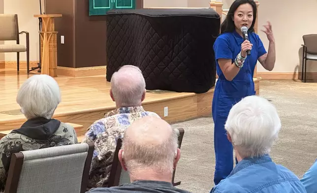 Francesca Hong, a candidate for Wisconsin governor, speaks to voters at a retirement home, Tuesday, July 7, 2026, in Madison, Wis. (AP Photo/Scott Bauer)