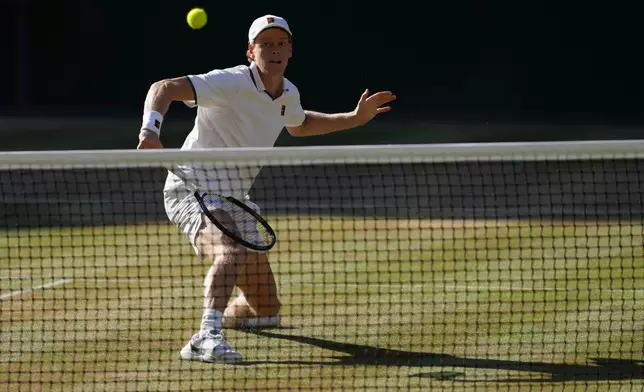 Jannik Sinner of Italy returns the ball to Alexander Zverev of Germany in the men's singles final at Wimbledon Tennis Championships in London, Sunday, July 12, 2026. (AP Photo/Kirsty Wigglesworth)