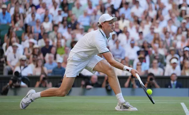 Jannik Sinner of Italy plays a return to Alexander Zverev of Germany during the men's singles final at Wimbledon Tennis Championships in London, Sunday, July 12, 2026. (AP Photo/Kin Cheung)