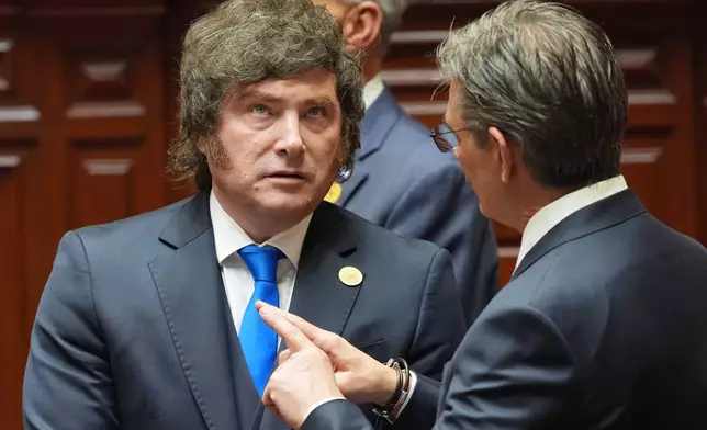 Argentina's President Javier Milei, left, talks to Bolivia's President Rodrigo Paz the inauguration of Peru's new President Keiko Fujimori in Lima, Peru, Tuesday, July 28, 2026.(AP Photo/Guadalupe Pardo, Pool)