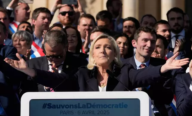 FILE - French far-right leader Marine Le Pen delivers her speech during the French far-right party national rally near the parliament in Paris, Sunday, April 6, 2025. (AP Photo/Michel Euler, File)