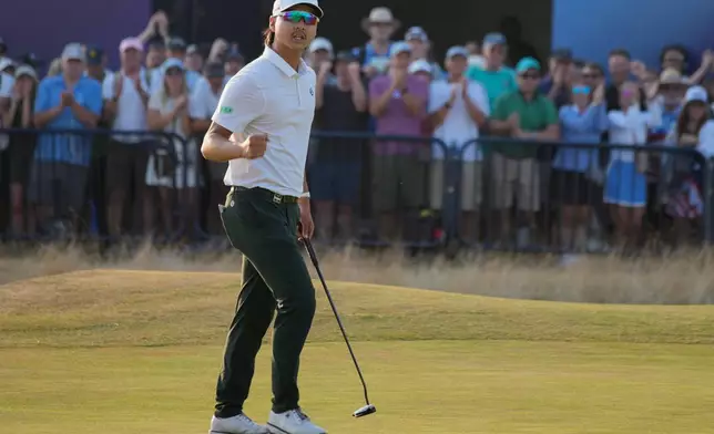 Min Woo Lee of Australia reacts after putting on the 18th green during the second day of the British Open Golf championships at Royal Birkdale golf club, in Southport, England, Friday, July 17, 2026. (AP Photo/David Goldman)