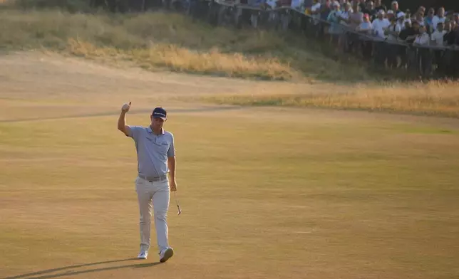Justin Rose acknowledges the crowd as he walks onto the 18th green during the second day of the British Open Golf championships at Royal Birkdale golf club, in Southport, England, Friday, July 17, 2026. (AP Photo/David Goldman)