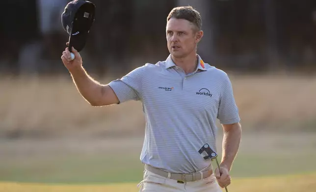 Justin Rose of England acknowledges the crowd after completing his second round on the 18th green during the second day of the British Open Golf championships at Royal Birkdale golf club, in Southport, England, Friday, July 17, 2026. (AP Photo/David Goldman)