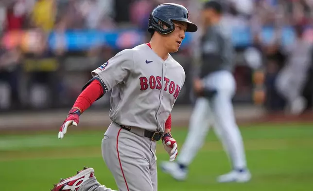 Boston Red Sox's Masataka Yoshida, of Japan, runs the bases after hitting a two-run home run during the eighth inning of a baseball game against the New York Mets Saturday, July 11, 2026, in New York. (AP Photo/Frank Franklin II)