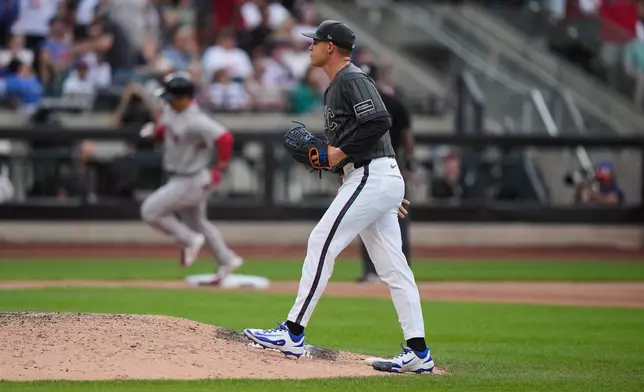 New York Mets pitcher Tobias Myers, right, reacts as Boston Red Sox's Masataka Yoshida runs the bases after hitting a two-run home run during the eighth inning of a baseball game Saturday, July 11, 2026, in New York. (AP Photo/Frank Franklin II)