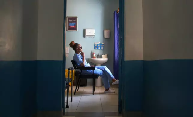Hannah Ruguru, a health worker at Marie Stopes clinic, sits in a consultation room in Kisumu, Kenya, July 18, 2025. (AP Photo/Annie Risemberg)
