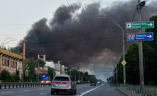 Smoke rises over the city after a Russian attack on Kyiv, Ukraine, Ukraine, Sunday, July 19, 2026. (AP Photo/Efrem Lukatsky)