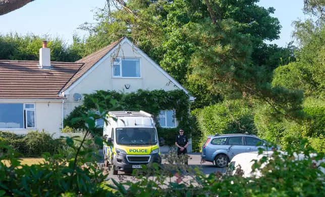 Police outside the house of former lawmaker Ann Widdecombe, in Haytor, England, Friday July 10, 2026, after she was found dead in her home on Thursday with serious injuries. (Matt Keeble/PA via AP)