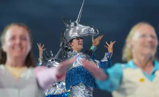 Performers take part in the Commonwealth Games opening ceremony in Glasgow, Scotland, Thursday, July 23, 2026. (AP Photo/Kin Cheung)