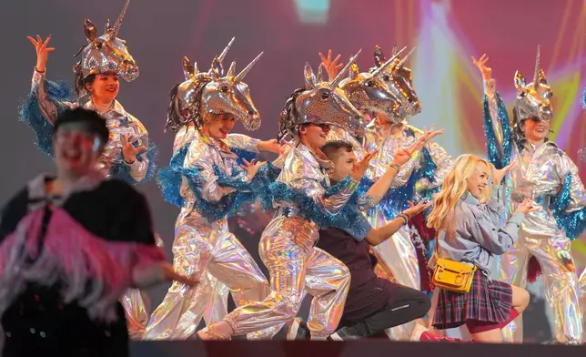 Performers take part in the Commonwealth Games opening ceremony in Glasgow, Scotland, Thursday, July 23, 2026. (AP Photo/Kin Cheung)