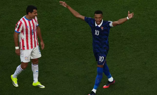 France's Kylian Mbappe, right, celebrates after scoring the opening goal from the penalty spot against Paraguay during the World Cup round of 16 soccer match in Philadelphia, Saturday, July 4, 2026. (AP Photo/Matt Rourke)