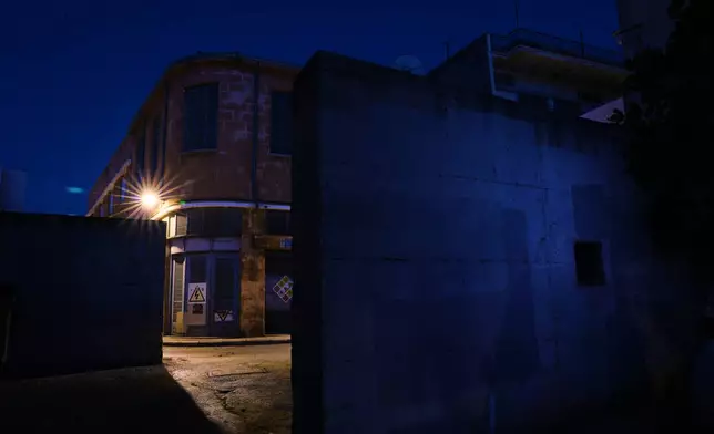 A wall stands near the U.N buffer zone separating the Greek Cypriot south from the Turkish Cypriot north, established after the July 20, 1974 Turkish invasion of Cyprus, in the medieval core of the divided capital of Nicosia, Cyprus, on July 22, 2026. (AP Photo/Petros Karadjias)
