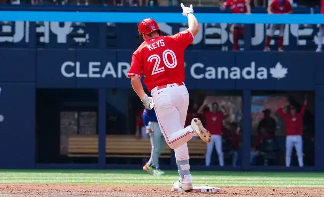 Toronto Blue Jays third baseman Sean Keys (20) rounds the bases after hitting a three run home run against the New York Mets during third inning MLB baseball action in Toronto on Wednesday, July 1, 2026. (Frank Gunn/The Canadian Press via AP)