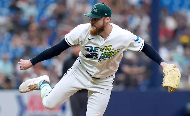 Tampa Bay Rays pitcher Bryan Baker follows through on a delivery against the Cleveland Guardians during the ninth inning of a baseball game Sunday, July 26, 2026, in St. Petersburg, Fla. (AP Photo/Chris O'Meara)