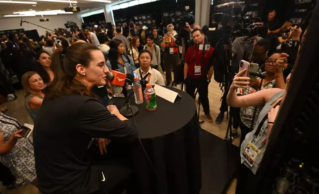 WNBA All Star Caitlin Clark speaks to the media during practice at the Obama Presidential Center in Chicago, Friday, July 24, 2026. (AP Photo/Paul Beaty)