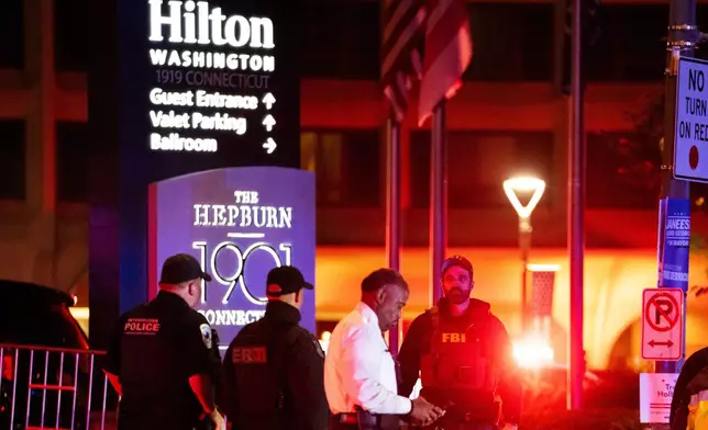 FILE - Law enforcement responds to an incident at the Washington Hilton during the White House Correspondents Dinner, April 25, 2026, in Washington. (AP Photo/Allison Robbert, File)