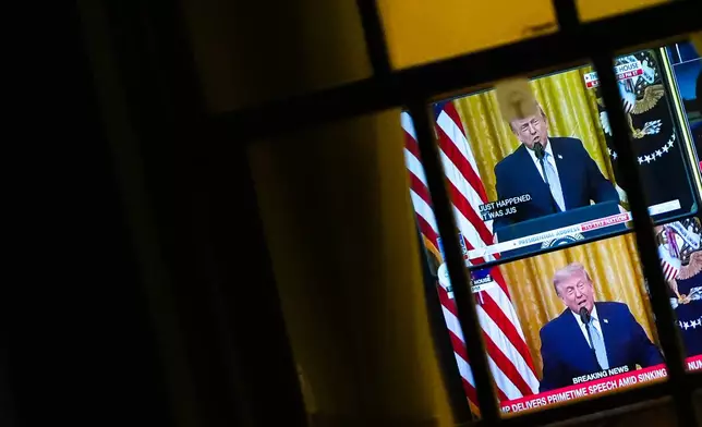 President Donald Trump is seen speaking from the East Room on a television in the West Wing of the White House, Thursday, July 16, 2026, in Washington. (AP Photo/Julia Demaree Nikhinson)