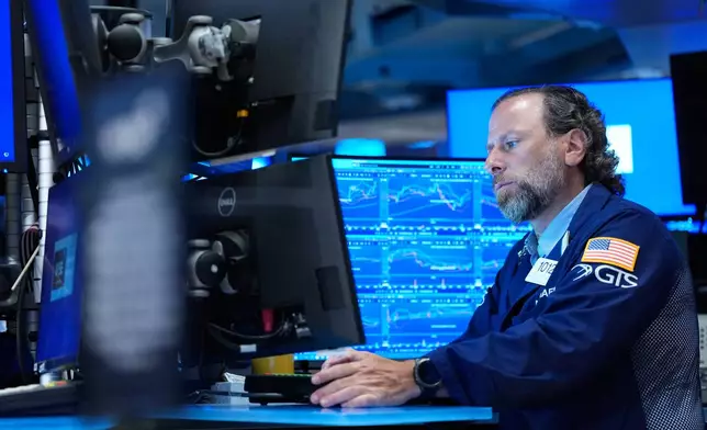 Michael Pistillo works on the floor at the New York Stock Exchange in New York, Monday, July 6, 2026. (AP Photo/Seth Wenig)