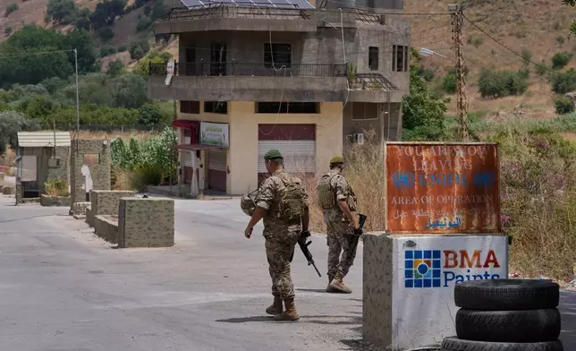 Lebanese army soldiers stand at a checkpoint in Froun village, southern Lebanon, Thursday, July 16, 2026. (AP Photo/Mohammed Zaatari)