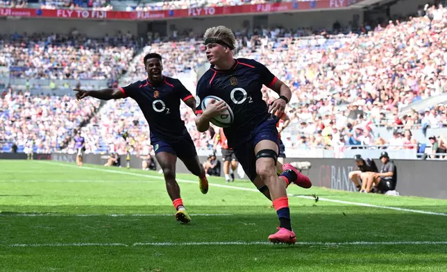 England's Henry Pollock scores a try during the Nations Championship rugby match between England and Fiji in Liverpool, England, Saturday, July 11, 2026. (Bruce Rollinson/PA via AP)