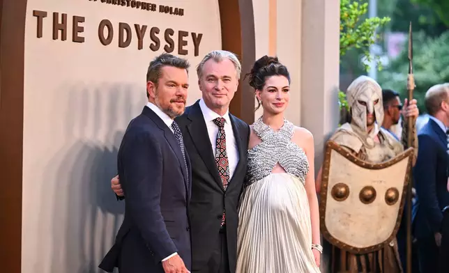 Matt Damon, from left, director Christopher Nolan, and Anne Hathaway attend the premiere of "The Odyssey" at AMC Lincoln Square on Tuesday, July 14, 2026, in New York. (Photo by Evan Agostini/Invision/AP)