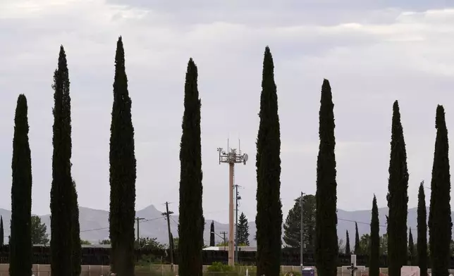 FILE - Surveillance technology used by various law enforcement sit on a tower at the border wall, July 28, 2025, in Douglas, Ariz. (AP Photo/Ross D. Franklin, File)