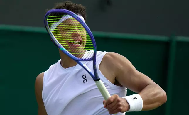 Ben Shelton of the United States plays a return to Otto Virtanen of Finland during their men's singles match at the Wimbledon Tennis Championships in London, Tuesday, June 30, 2026.(AP Photo/Brian Inganga)