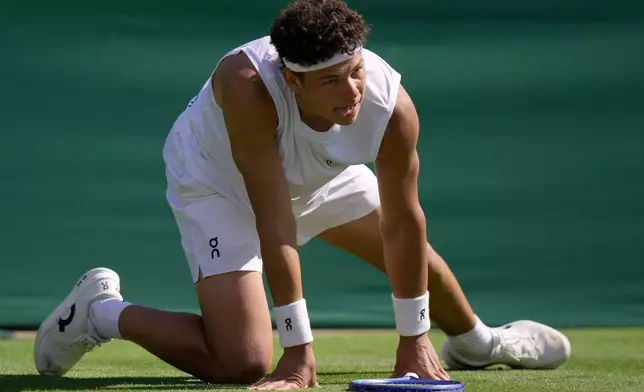 Ben Shelton of the United States reacts as he plays Otto Virtanen of Finland during their men's singles match at the Wimbledon Tennis Championships in London, Tuesday, June 30, 2026.(AP Photo/Brian Inganga)