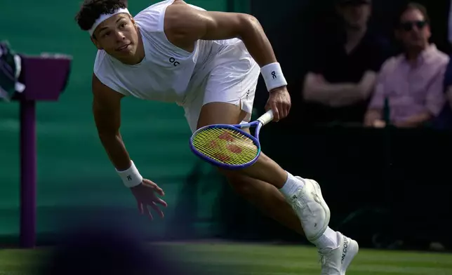 Ben Shelton of the United States runs for the ball as he plays against Otto Virtanen of Finland during their men's singles match at the Wimbledon Tennis Championships in London, Tuesday, June 30, 2026.(AP Photo/Brian Inganga)