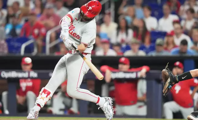 Philadelphia Phillies' Bryce Harper hits a two run home run during the first inning of a baseball game against the Miami Marlins, Monday, July 27, 2026, in Miami. (AP Photo/Lynne Sladky)