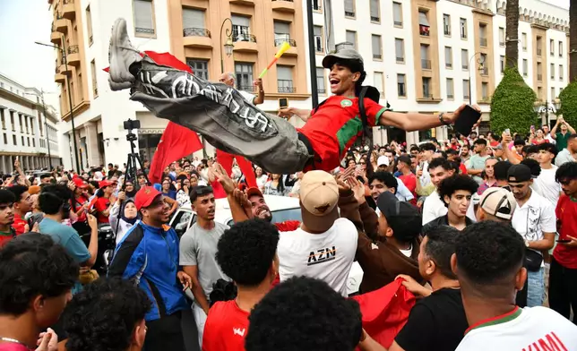 Fans celebrate after Morocco defeated Canada in a World Cup round of 16 soccer match, in Rabat Saturday, July 4, 2026. (AP Photo)