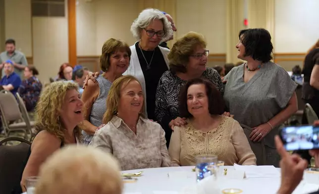 Friends, family and community members gather for the retirement dinner celebration of Rabbi Jeffrey Myers of the Tree of Life Congregation on Friday, July 17, 2026, at Rodef Shalom Congregation in Pittsburgh. (AP Photo/Jessie Wardarski)