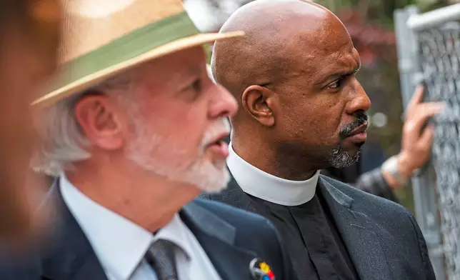 FILE - Rabbi Jeffrey Myers, of Pittsburgh's Tree of Life Congregation, left, speaks about the memorial for the victims of the Tree of Life Synagogue mass shooting accompanied by Pastor Eric Manning, of Emanuel AME Church of Charleston, S. C., during a special prayer service with survivors and relatives of the Emanuel AME Church mass shooting in 2015 and Tree of Life Synagogue mass shooting in 2018, Friday, May 3, 2019, at the Tree of Life Synagogue in Pittsburgh. (Michael M. Santiago/Pittsburgh Post-Gazette via AP, File)