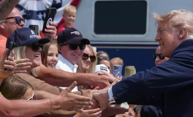 President Donald Trump greets supporters after arriving on a Freedom 250 train, Wednesday, July 1, 2026, in Medora, N.D. (AP Photo/Julia Demaree Nikhinson)
