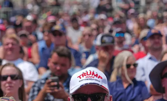 People listen as President Donald Trump speaks at Burning Hills Amphitheatre during the Theodore Roosevelt Presidential Library opening ceremony, Wednesday, July 1, 2026, in Medora, N.D. (AP Photo/Julia Demaree Nikhinson)