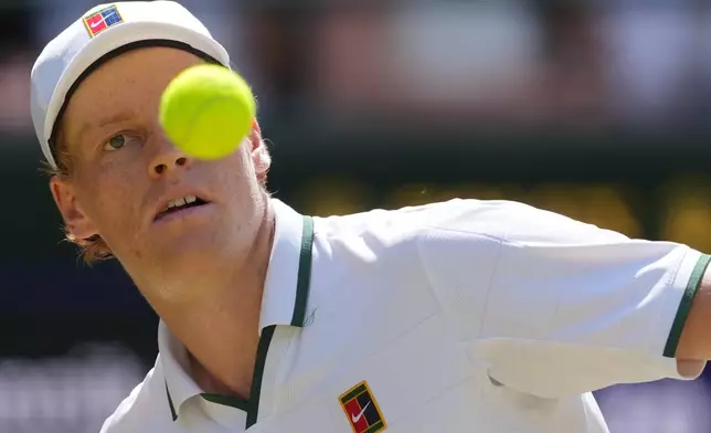 Jannik Sinner of Italy eyes the ball as he prepares to play a forehand against Jan-Lennard Struff of Germany in their quarter-final men's singles match at the Wimbledon Tennis Championships in London, Tuesday, July 7, 2026. (AP Photo/Kin Cheung)