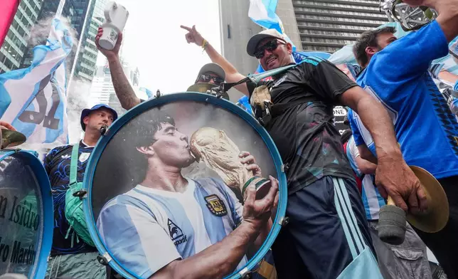 Argentina fans gather for a rally on the eve of the World Cup final soccer match in New York's Times Square, Saturday, July 18, 2026 (AP Photo/Frank Franklin II)