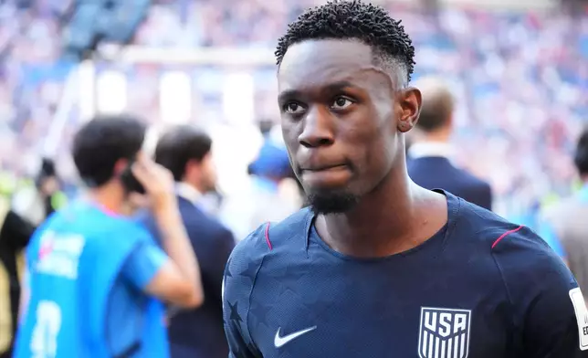 United States' Folarin Balogun (20) walks off the pitch after losing to Belgium in their World Cup round of 16 soccer match in Seattle, Monday, July 6, 2026. (AP Photo/Ted S. Warren)