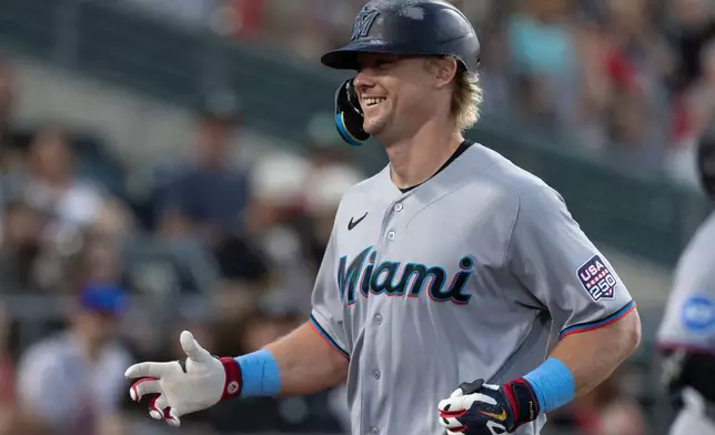 Miami Marlins' Kyle Stowers celebrates after hitting a two-run home run during the seventh inning of a baseball game against the Athletics Saturday, July 4, 2026, in West Sacramento, Calif. (AP Photo/Sara Nevis)