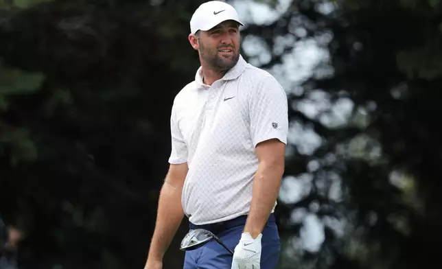 Scottie Scheffler reacts to his shot from the second tee during the final round of the 3M Open golf tournament at the Tournament Players Club Sunday, July 26, 2026, in Blaine, Minn. (AP Photo/Bailey Hillesheim)