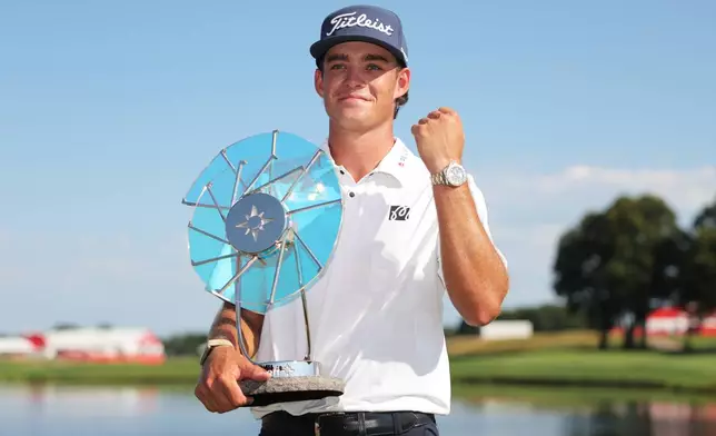 Jackson Koivun holds his trophy after winning the 3M Open golf tournament at the Tournament Players Club Sunday, July 26, 2026, in Blaine, Minn. (AP Photo/Bailey Hillesheim)