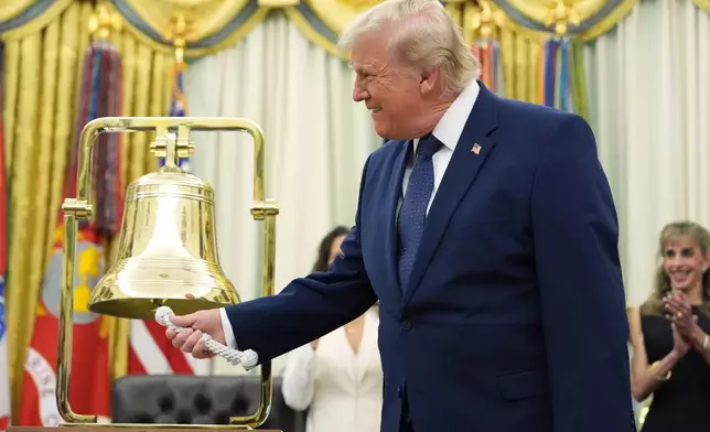 President Donald Trump rings the opening bell for the New York Stock Exchange and the Nasdaq markets in the Oval Office at the White House, Monday, July 6, 2026, in Washington. (AP Photo/Mark Schiefelbein)