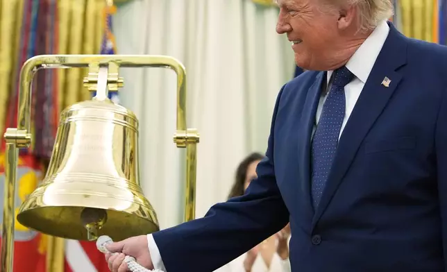 President Donald Trump rings the opening bell for the New York Stock Exchange and the Nasdaq in the Oval Office at the White House, Monday, July 6, 2026, in Washington. (AP Photo/Mark Schiefelbein)